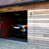 Houten sectionale garagedeuren - in lijn met de gevel - Padoek - onbehandeld